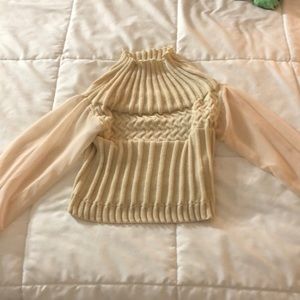 Pale pink sweater with sheer sleeves